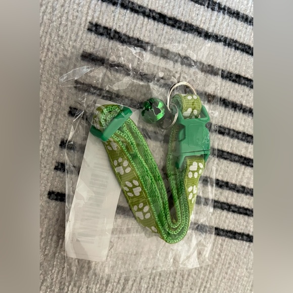 Collar with White Paw Print Pattern and Matching Bell and Buckle - Picture 11 of 15